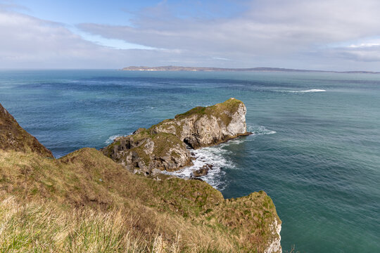 Panoramic rocky peninsula along the Northern Irish coastline in County Antrim