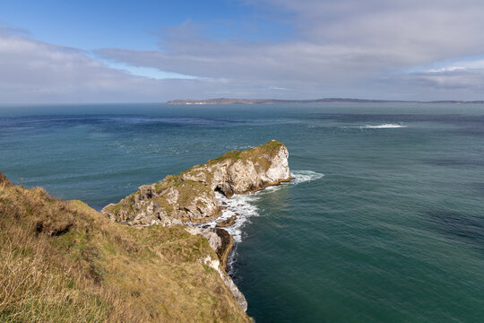 Panoramic rocky peninsula along the Northern Irish coastline in County Antrim