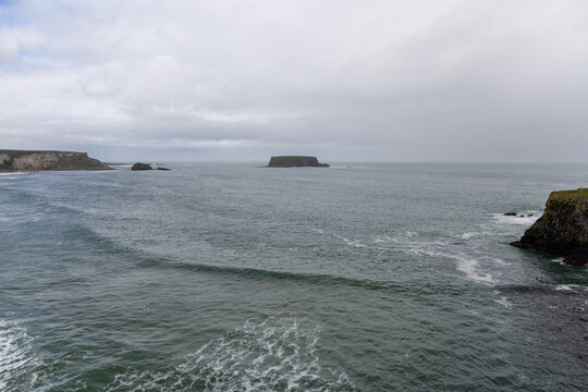 Rugged coastal landscape with cliffs and sea in County Antrim, Northern Ireland