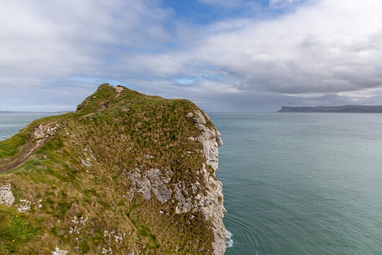 Panoramic rocky peninsula along the Northern Irish coastline in County Antrim