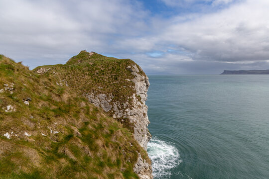 Panoramic rocky peninsula along the Northern Irish coastline in County Antrim