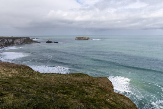 Rugged coastal landscape with cliffs and sea in County Antrim, Northern Ireland