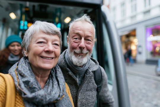 Senior Couple Smiling While Commuting by Public Bus