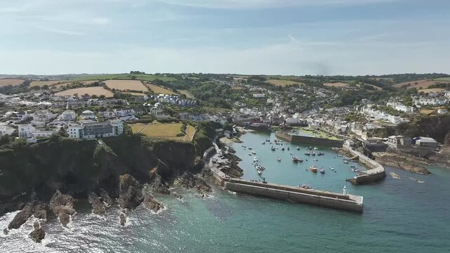 Cliffs and a harbor over Port Village from a drone, Charlestown, St Austell, Cornwall, England
