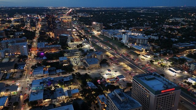 Aerial view of downtown city lights of while the sun is setting