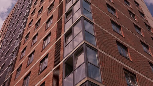 Completed glazing on modern brick residential building facade