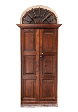 Vintage rustic brown wooden entrance door featuring classic panels, decorative central molding, and semicircular arched top window with fan-shaped iron security bars. Isolated on white clipping path. 
