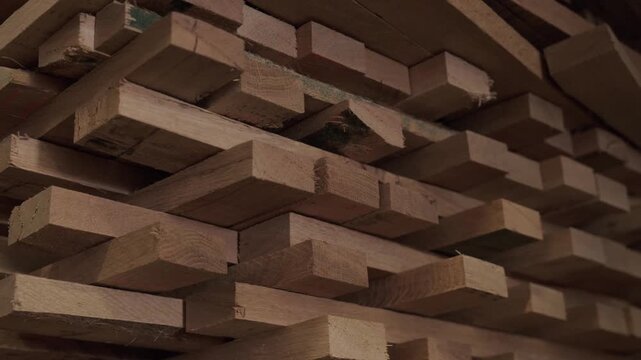 Close-up of industrial automated CNC woodworking machine cutting wood component in modern furniture factory
