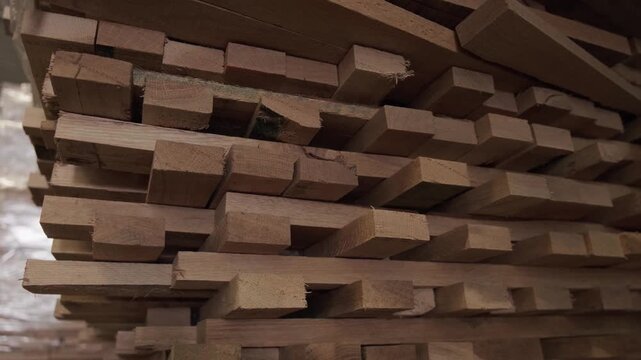 Close-up of industrial automated CNC woodworking machine cutting wood component in modern furniture factory