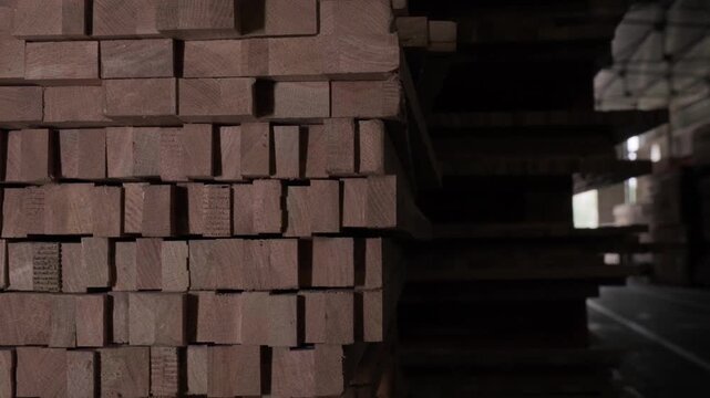 Close-up of industrial automated CNC woodworking machine cutting wood component in modern furniture factory