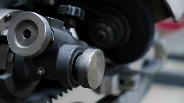Close-up of industrial automated CNC woodworking machine cutting wood component in modern furniture factory
