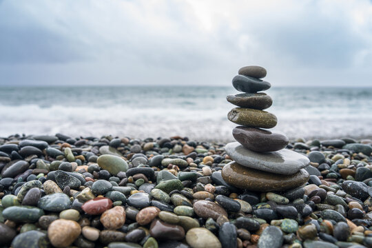Balancing stones on the seashore