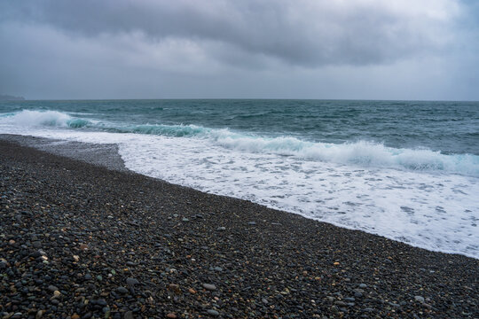 A gloomy summer seashore. Summer sea view.