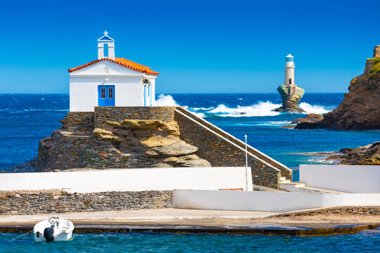 The beautiful Lighthouse Tourlitis of Chora at night. Andros island, Cyclades, Greece
