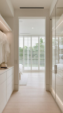 Walk in closet modern interior illuminated wardrobe white clothing glass cabinet bright bedroom