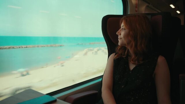 The Italian sea and beaches of Calabria, seen by a woman traveling on a train