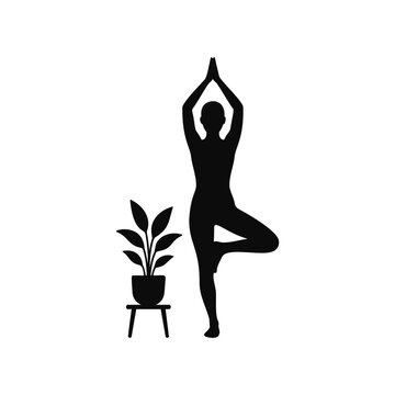Silhouette of woman in yoga tree pose with plant