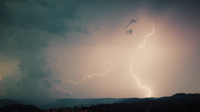Thunderstorm summer with strong lightning in the night sky over mountains