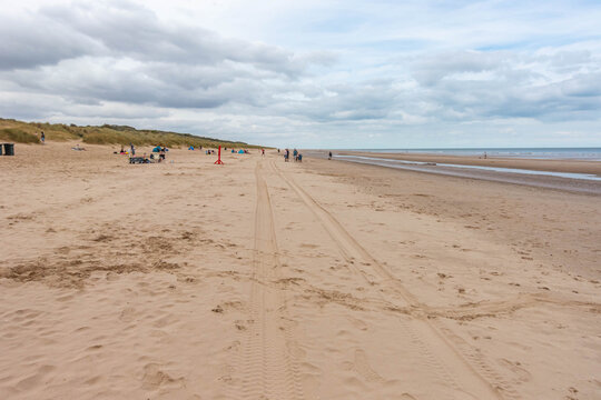 Mablethorpe North End beach is a sandy beach in Lincolnshire, UK seen here beneath a moody, clouds sky
