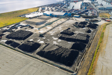 Fototapeta premium Aerial View of Coal Piles and Storage Facility at the Port of Cork During a Bright Afternoon Day
