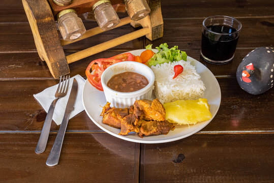 Traditional brazilian dish with beans rice and meat