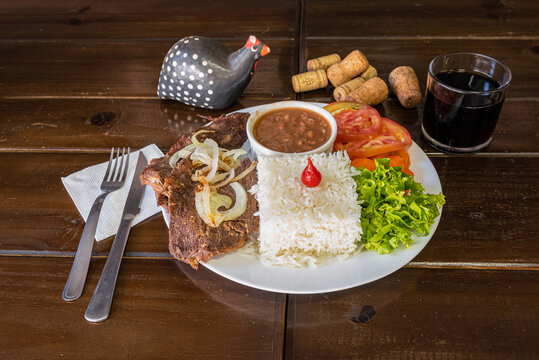 Brazilian food dish meal with rice and meat