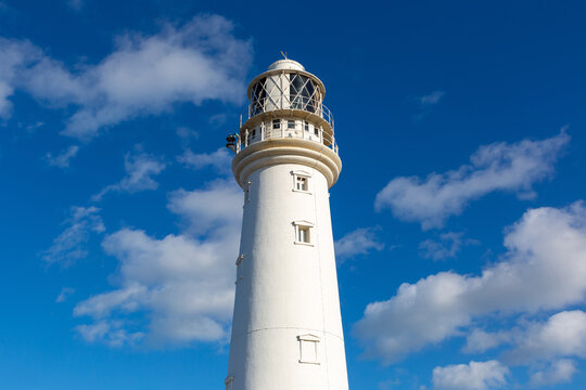 Flamborough Head Lighthouse against Blue Sky in Flamborough, England, UK
