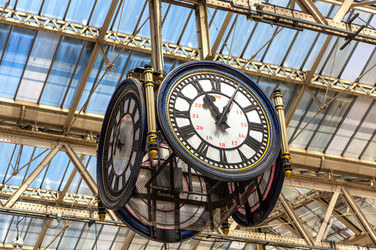 Vintage Station Clock under Glass Roof at Waterloo railway Station in London, England, UK