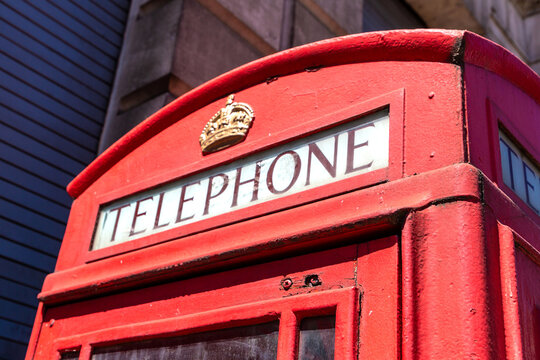 Classic Red Telephone Boxes on City Street in London, England, UK