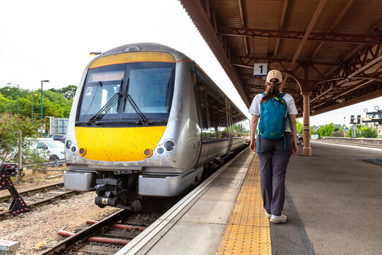 Female Tourist with Diesel Train at Royal Leamington Spa Railway Station, Warwickshire, England, UK