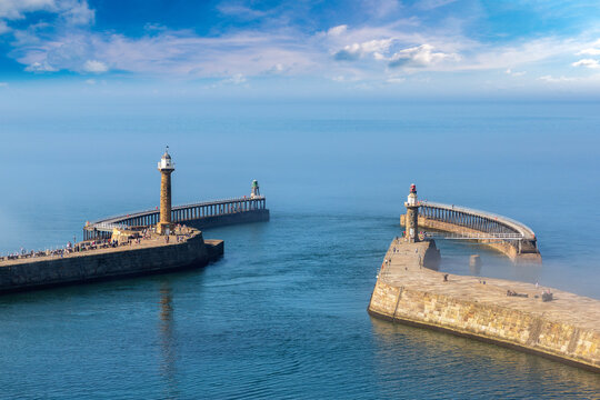 Whitby Harbour Piers with Lighthouses in Whitby, England, UK