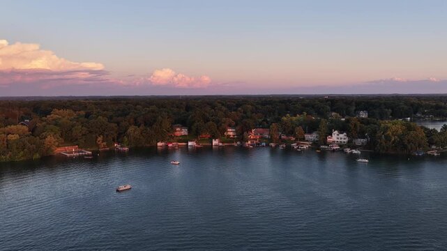  Aerial Twilight View of Lakeshore Homes, Lauderdale Lakes, Wisconsin on August 21  Aerial drone view of a residential lakeshore at twilight on Lauderdale Lakes near Elkhorn, Wisconsin. Waterfront