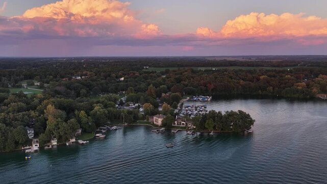  Aerial View of Lauderdale Lakes at Sunset, Elkhorn, Wisconsin &ndash; Golden Clouds Over Lakeside Forest and Shoreline&rdquo; on August 21 2026