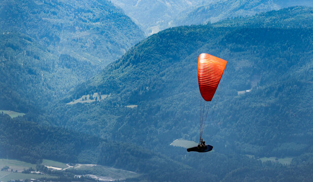 Paragliding sport activity. Parachute in the sky. Extreme rest and paragliding. Summer vacation. Extreme sport. Parachute paraglide. Sport and activity lifestyle. Paraglider paragliding recreation
