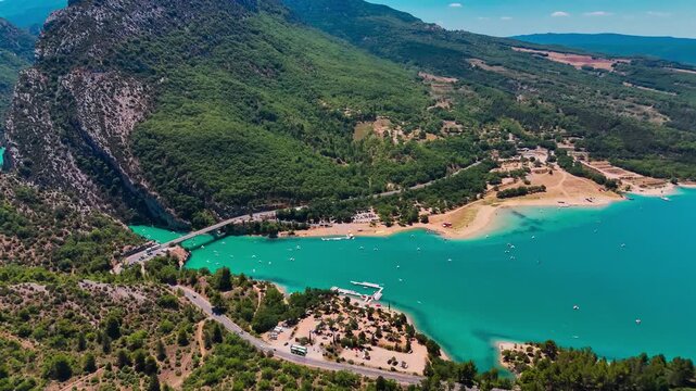 Aerial drone view of the turquoise Verdon River flowing through the Verdon Gorge river canyon in the Provence-Alpes-Cote d'Azur region of southeastern France. High quality 4k footage