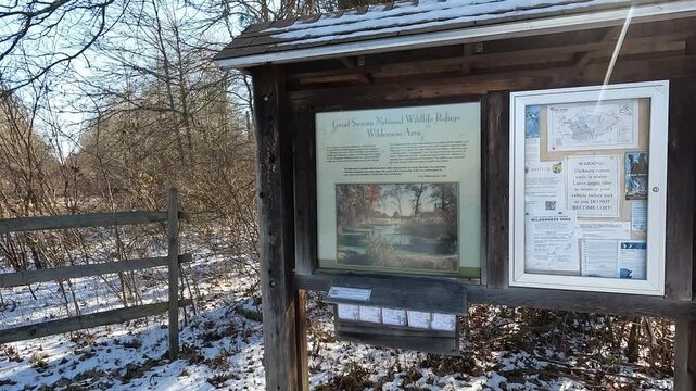 Great Swamp, Morristown, NJ, USA - 02-15-2026: trail head in the Great Swamp on a snowy February day
