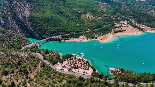 Aerial drone view of the turquoise Verdon River flowing through the Verdon Gorge river canyon in the Provence-Alpes-Cote d'Azur region of southeastern France. High quality 4k footage