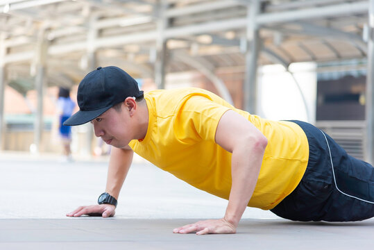 Asian man exercise in the gym. Healthy and Lifestyle Concept.