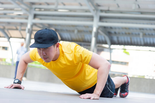Asian man exercise in the gym. Healthy and Lifestyle Concept.