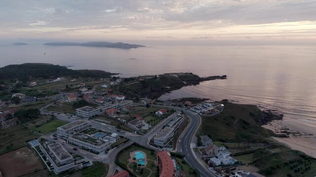 Aerial - Coastal resort hotels road and Atlantic coast near A Lanzada Galicia Spain