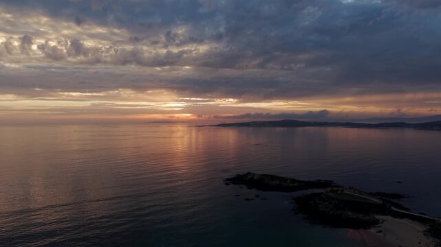 Sunset aerial view over Ermita de la Lanzada and Atlantic coast in Galicia Spain