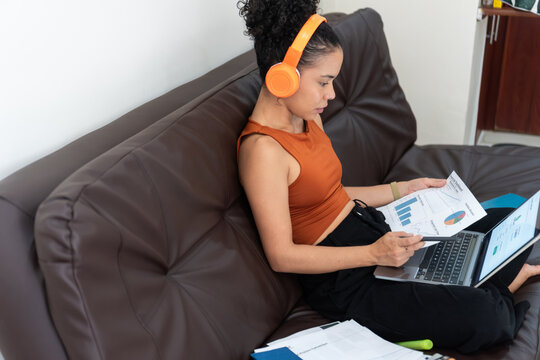 Woman working from home reviewing business analytics