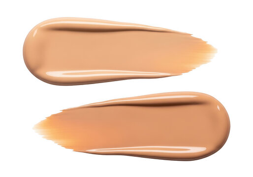 Two smooth beige liquid foundation makeup smears on a surface