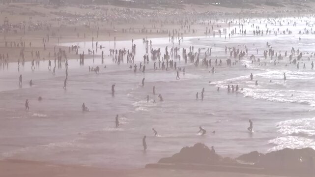 Crowded Beach Casablanca Morocco Atlantic Ocean Horizontal Footage People Swimming Waves Hazy Summer Seaside Silhouette North Africa Travel Coastal Video