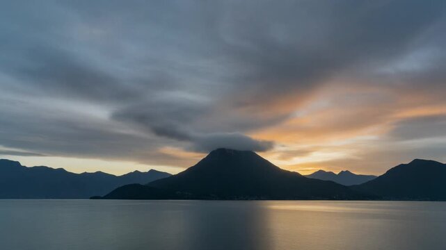 Sunrise over guatemala lake atitlan with volcanic silhouette