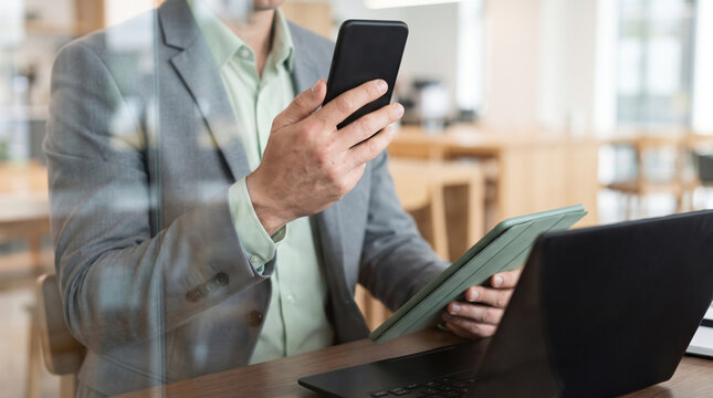 Working hybrid businessman smartphone tablet laptop office remote work technology. remote flexible freelance work. online home office workplace, employee job management, communication form