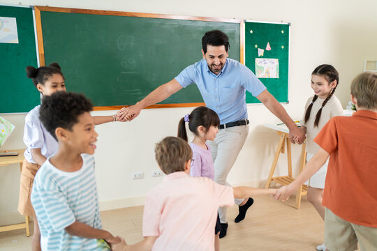 Multicultural children enjoying fun learning game together indoors. 