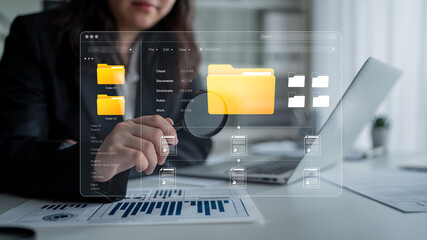 Businesswoman Using Digital Technology to Organize Data with Visual Interface and Magnifying Glass...