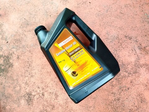 KUALA TERENGGANU, MALAYSIA- AUGUST 25. 2026: Toyota Genuine Motor Oil 15W-40 5L plastic jug for diesel engines, ideal for automotive maintenance and lubricant stock photography metadata.