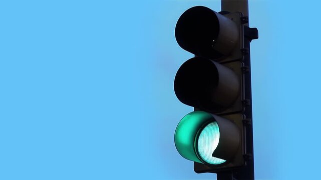 Close-Up Shot of Street Traffic Light Changing from Red to Green at Dusk - 4K